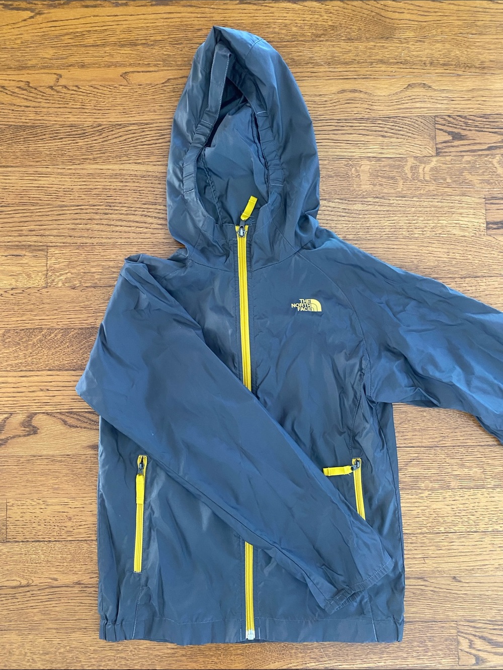 The North Face Blue Hooded Jacket with Yellow Zippers